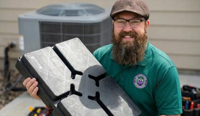 Solosalescompany owner holding equipment pads