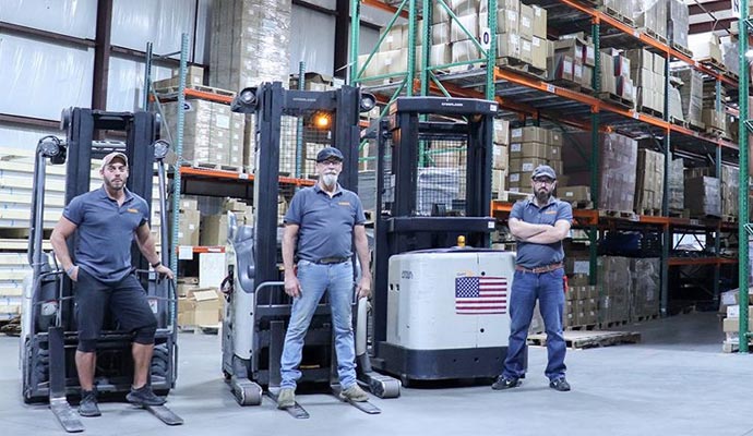 Warehouse team with forklifts and inventory
