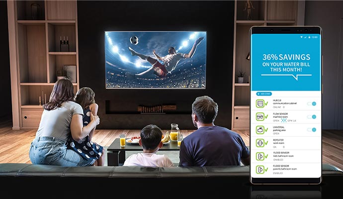 Family watching TV inside home space